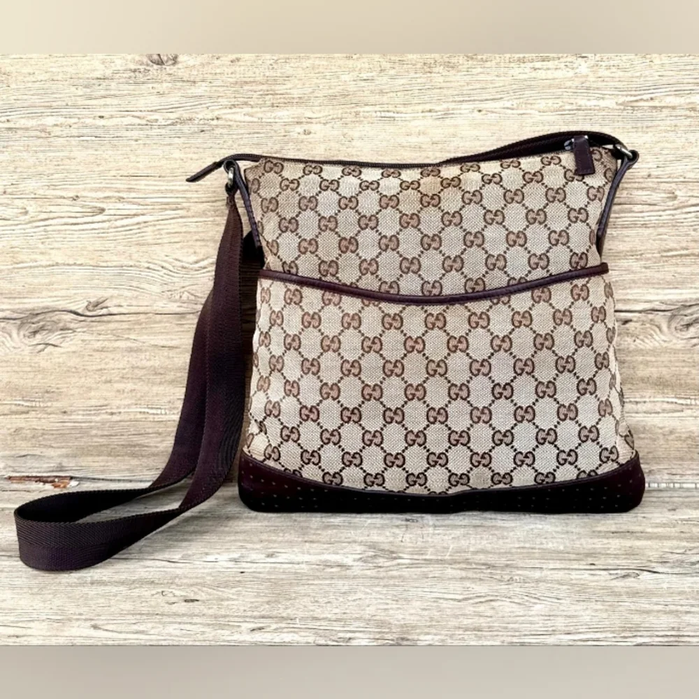 Gucci GG Monogram perforated leather messenger bag